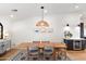 Open dining area with modern lighting, wood floors, and stylish decor at 26626 N 70Th Pl, Scottsdale, AZ 85266