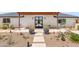 Close-up of the front entrance featuring a modern door and desert landscaping at 26626 N 70Th Pl, Scottsdale, AZ 85266