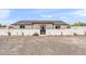 Stunning home with a sleek, modern exterior, walled perimeter, and desert landscaping at 26626 N 70Th Pl, Scottsdale, AZ 85266