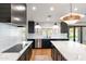 Modern kitchen featuring sleek cabinetry, an island, stainless appliances, and lots of natural light at 26626 N 70Th Pl, Scottsdale, AZ 85266