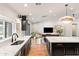 Open-concept kitchen with an island, marble countertops, and seamless access to the living area at 26626 N 70Th Pl, Scottsdale, AZ 85266