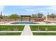 Beautiful pool area with artificial turf, desert landscaping, and pergola at 26626 N 70Th Pl, Scottsdale, AZ 85266