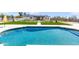 Stunning backyard pool with artificial turf and walkways leading up to a well manicured modern home at 26626 N 70Th Pl, Scottsdale, AZ 85266