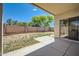 A covered patio transitions to a sunny backyard and desert landscaping at 2853 E Cathy Dr, Gilbert, AZ 85296