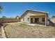 Spacious backyard featuring a covered patio and desert landscaping at 2853 E Cathy Dr, Gilbert, AZ 85296