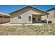 Exterior backyard featuring covered patio and desert landscaping at 2853 E Cathy Dr, Gilbert, AZ 85296
