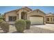 Charming home featuring a two-car garage, landscaped yard, and an inviting entryway at 2853 E Cathy Dr, Gilbert, AZ 85296