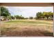 Back patio view of expansive green space and mature trees in a community park at 2853 E Cathy Dr, Gilbert, AZ 85296