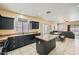 Open-concept kitchen with dark cabinetry, granite counters, and adjacent dining area at 2853 E Cathy Dr, Gilbert, AZ 85296