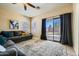 Bright living room with neutral color palette, sliding glass doors to the backyard, and ceiling fan at 2853 E Cathy Dr, Gilbert, AZ 85296