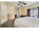 Main bedroom with carpet flooring, ensuite bathroom access, and sliding glass door with backyard access at 2853 E Cathy Dr, Gilbert, AZ 85296