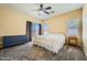 Bright main bedroom featuring neutral walls, carpet, and a sliding door for outdoor access at 2853 E Cathy Dr, Gilbert, AZ 85296