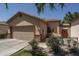 Charming single-story home featuring a two-car garage and a cozy front patio area at 3098 E Stottler Dr, Gilbert, AZ 85296