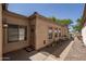 Charming exterior view of the home with potted plants along the walkway and front door at 3098 E Stottler Dr, Gilbert, AZ 85296
