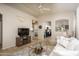 Open living space with tile floors, a decorative fireplace, and seamless flow into other areas at 3098 E Stottler Dr, Gilbert, AZ 85296
