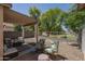 Covered patio with comfortable seating area and view of the backyard and neighborhood park at 3098 E Stottler Dr, Gilbert, AZ 85296