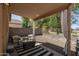 Relaxing covered patio with outdoor seating and shade, perfect for enjoying the backyard view at 3098 E Stottler Dr, Gilbert, AZ 85296