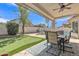 Enjoy the backyard featuring a covered patio, putting green, and sparkling pool, perfect for relaxation and entertainment at 3139 E Runaway Bay Pl, Chandler, AZ 85249