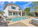 Beautiful backyard with a sparkling pool, lounge chairs, covered patio, and well-maintained landscaping at 3139 E Runaway Bay Pl, Chandler, AZ 85249