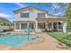Relaxing backyard showcasing a pool, lounge area, covered patio, and manicured landscaping perfect for outdoor living at 3139 E Runaway Bay Pl, Chandler, AZ 85249