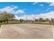 Outdoor basketball court surrounded by lush green grass and mature trees in a Gathering-friendly community at 3139 E Runaway Bay Pl, Chandler, AZ 85249