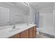 Bathroom featuring double sinks and a shower-tub combination at 3139 E Runaway Bay Pl, Chandler, AZ 85249