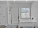 Clean bathroom featuring a glass-enclosed shower, soaking tub, and neutral color palette at 3139 E Runaway Bay Pl, Chandler, AZ 85249