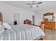 Comfortable bedroom featuring a wooden bed frame, ample closet space, and well-lit interiors at 3139 E Runaway Bay Pl, Chandler, AZ 85249