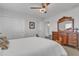 Bedroom with a large wooden dresser and a view of the closet and en-suite bathroom at 3139 E Runaway Bay Pl, Chandler, AZ 85249