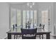 Inviting dining area with natural light, plantation shutters, and a view of the outdoors at 3139 E Runaway Bay Pl, Chandler, AZ 85249