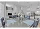 Bright dining area featuring modern lighting, high ceilings, and easy access to the kitchen and living spaces at 3139 E Runaway Bay Pl, Chandler, AZ 85249