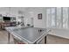 Well-lit game room featuring a ping pong table, bar, and easy access to other areas of the home at 3139 E Runaway Bay Pl, Chandler, AZ 85249