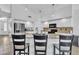 Bright kitchen with granite countertops, a large island with bar seating, and modern appliances at 3139 E Runaway Bay Pl, Chandler, AZ 85249