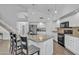 Stylish kitchen featuring granite countertops, a center island with seating, and modern appliances at 3139 E Runaway Bay Pl, Chandler, AZ 85249