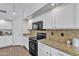 Well-equipped kitchen with granite countertops, modern appliances, and ample cabinet space at 3139 E Runaway Bay Pl, Chandler, AZ 85249