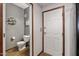 Half bath with tile flooring, gray walls, and modern fixtures at 3150 E Beardsley Rd # 1023, Phoenix, AZ 85050