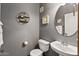 Stylish half-bathroom featuring decorative shelves and a modern vanity at 3150 E Beardsley Rd # 1023, Phoenix, AZ 85050