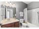 Well-lit bathroom with a single sink vanity, toilet, and shower-tub combo at 3150 E Beardsley Rd # 1023, Phoenix, AZ 85050