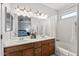 Bathroom featuring double vanity, tiled floors, and shower-tub combo at 3150 E Beardsley Rd # 1023, Phoenix, AZ 85050