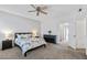 Comfortable bedroom with carpet flooring, a ceiling fan, and neutral paint at 3150 E Beardsley Rd # 1023, Phoenix, AZ 85050