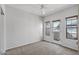 Bedroom with carpet flooring, a ceiling fan, and access to a patio at 3150 E Beardsley Rd # 1023, Phoenix, AZ 85050
