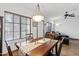Dining room area with wood table set, window and living room views at 3150 E Beardsley Rd # 1023, Phoenix, AZ 85050