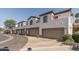 Exterior image displaying row of townhomes each featuring a private garage at 3150 E Beardsley Rd # 1023, Phoenix, AZ 85050