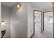 Neutral hallway with carpet flooring leading to various rooms in the home at 3150 E Beardsley Rd # 1023, Phoenix, AZ 85050