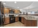 Well-equipped kitchen features modern appliances, plenty of counter space and warm wood cabinetry at 3150 E Beardsley Rd # 1023, Phoenix, AZ 85050