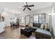Cozy living room with a large sectional sofa, ceiling fan, and tile floors at 3150 E Beardsley Rd # 1023, Phoenix, AZ 85050