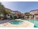 Community pool and spa area with shaded seating and mature trees at 3150 E Beardsley Rd # 1023, Phoenix, AZ 85050