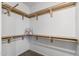 Walk-in closet with built-in shelves, providing ample storage space at 3150 E Beardsley Rd # 1023, Phoenix, AZ 85050