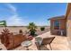Relaxing backyard patio with comfortable seating and desert landscaping, perfect for enjoying the outdoors at 3301 S Goldfield Rd # 6050, Apache Junction, AZ 85119