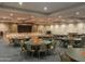 The community ballroom is decorated for a special event and set with round tables and chairs at 3301 S Goldfield Rd # 6050, Apache Junction, AZ 85119